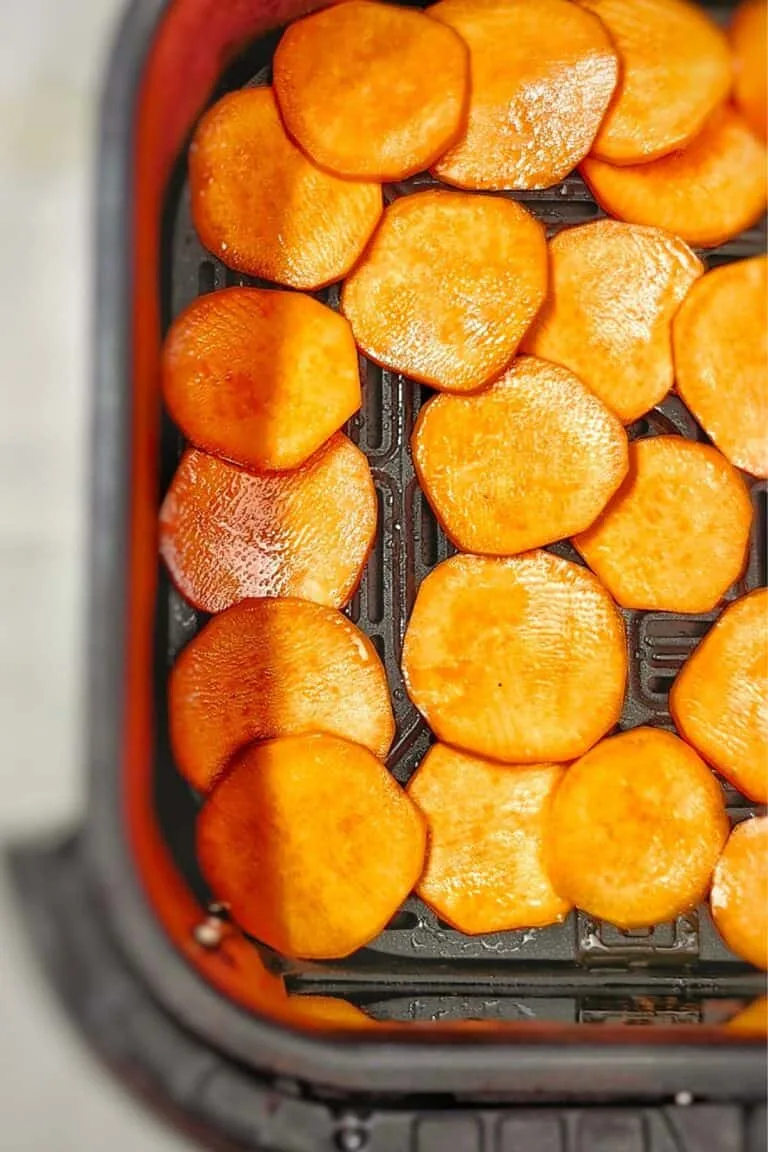 air fryer basket with sweet potatoes