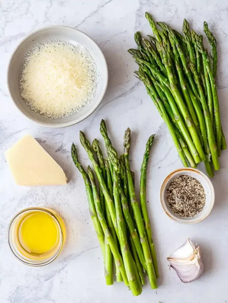 oiled asparagus in bowl with parmesan
