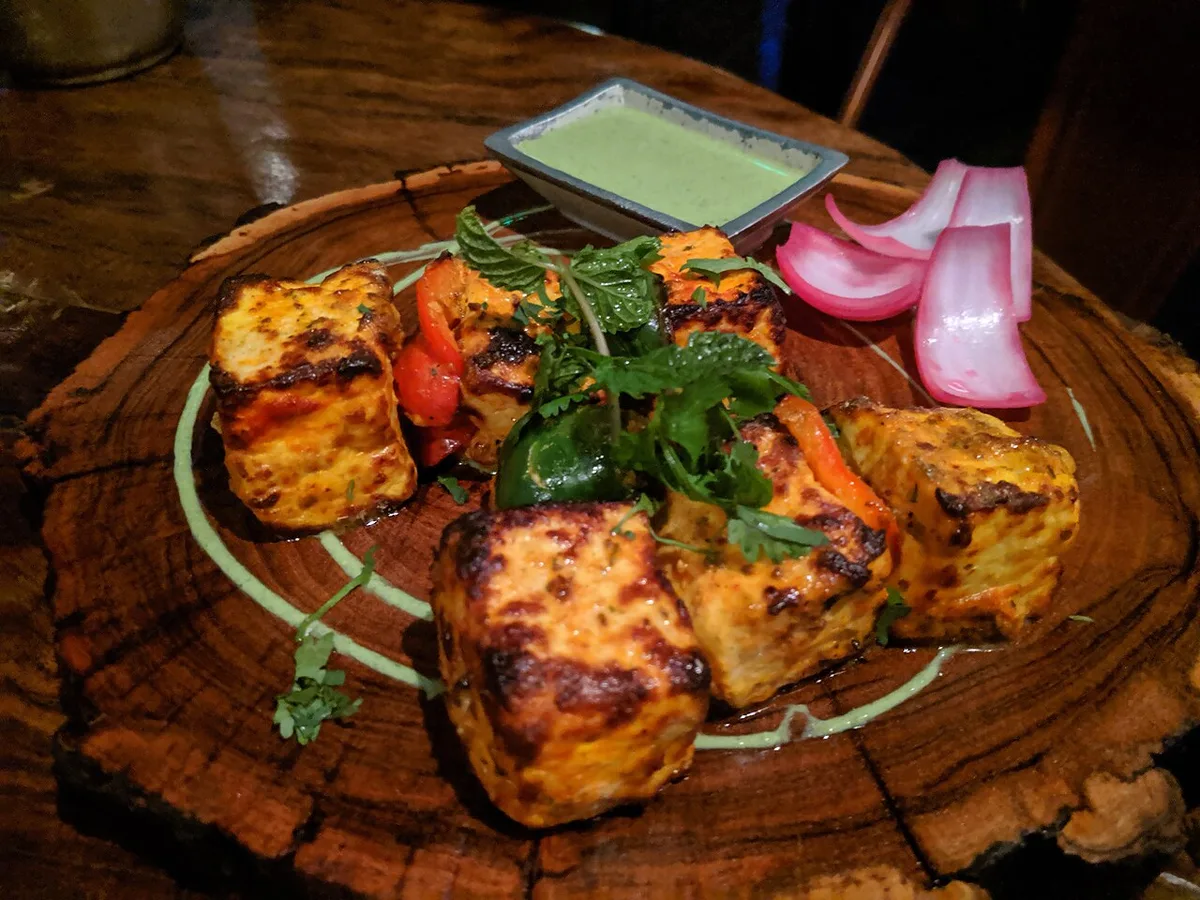 paneer cubes marinating in yogurt
