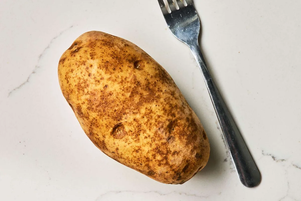 piercing potatoes with fork