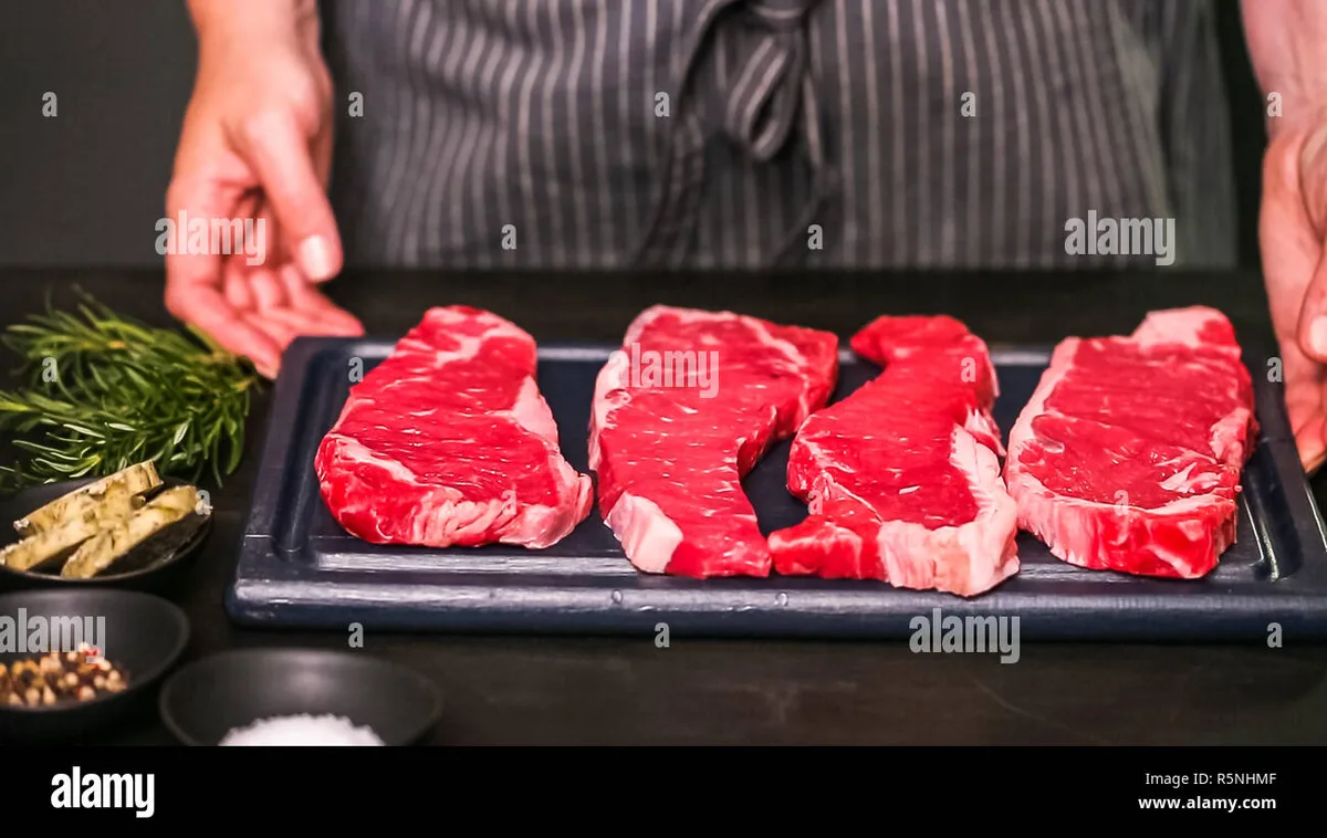 raw new york strip steak before air frying